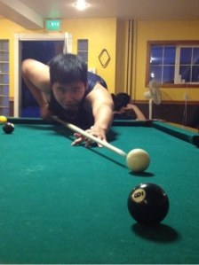 Student play pool in the PX at boarding school